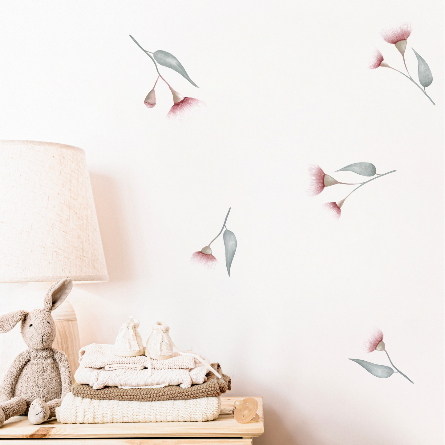 A kid's room with the wall adorned with pink eucalyptus gum blossom decals. Non-toxic, eco-friendly, reusable wall stickers. Australian made.