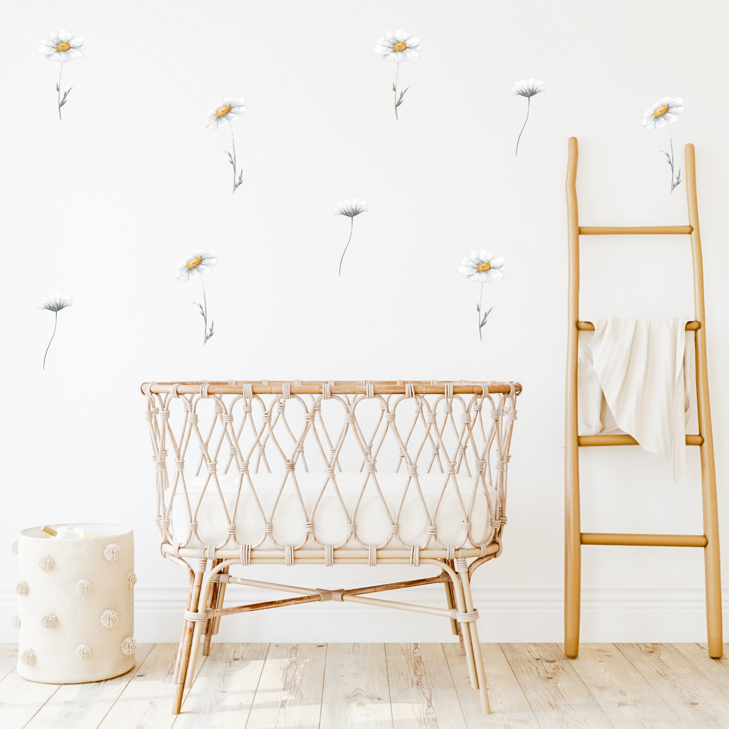 A baby's room with white walls decorated with yellow and white daisy wall decals. Non-toxic, eco-friendly, reusable fabric wall stickers. Australian made.