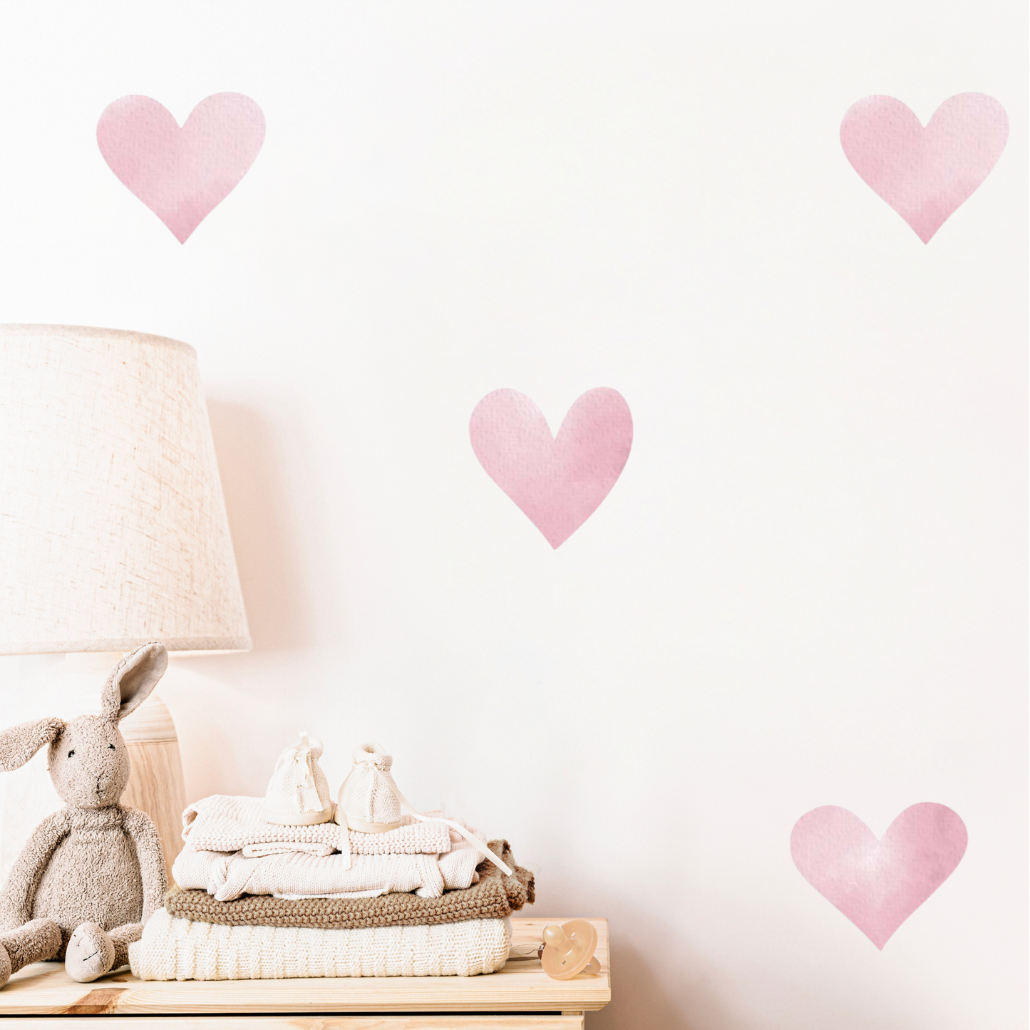 A series of pink heart-shaped wall decals. Non-toxic, eco-friendly, reusable wall stickers. Australian made.