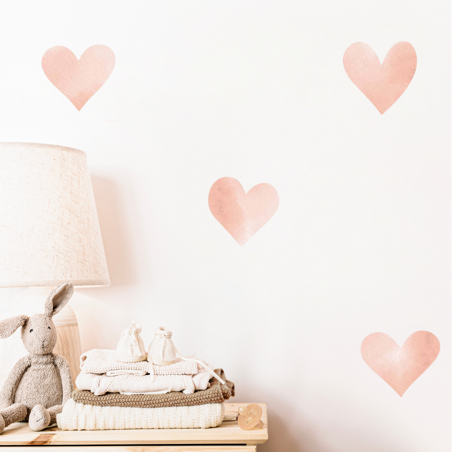 A series of peach heart-shaped wall decals. Non-toxic, eco-friendly, reusable wall stickers. Australian made.