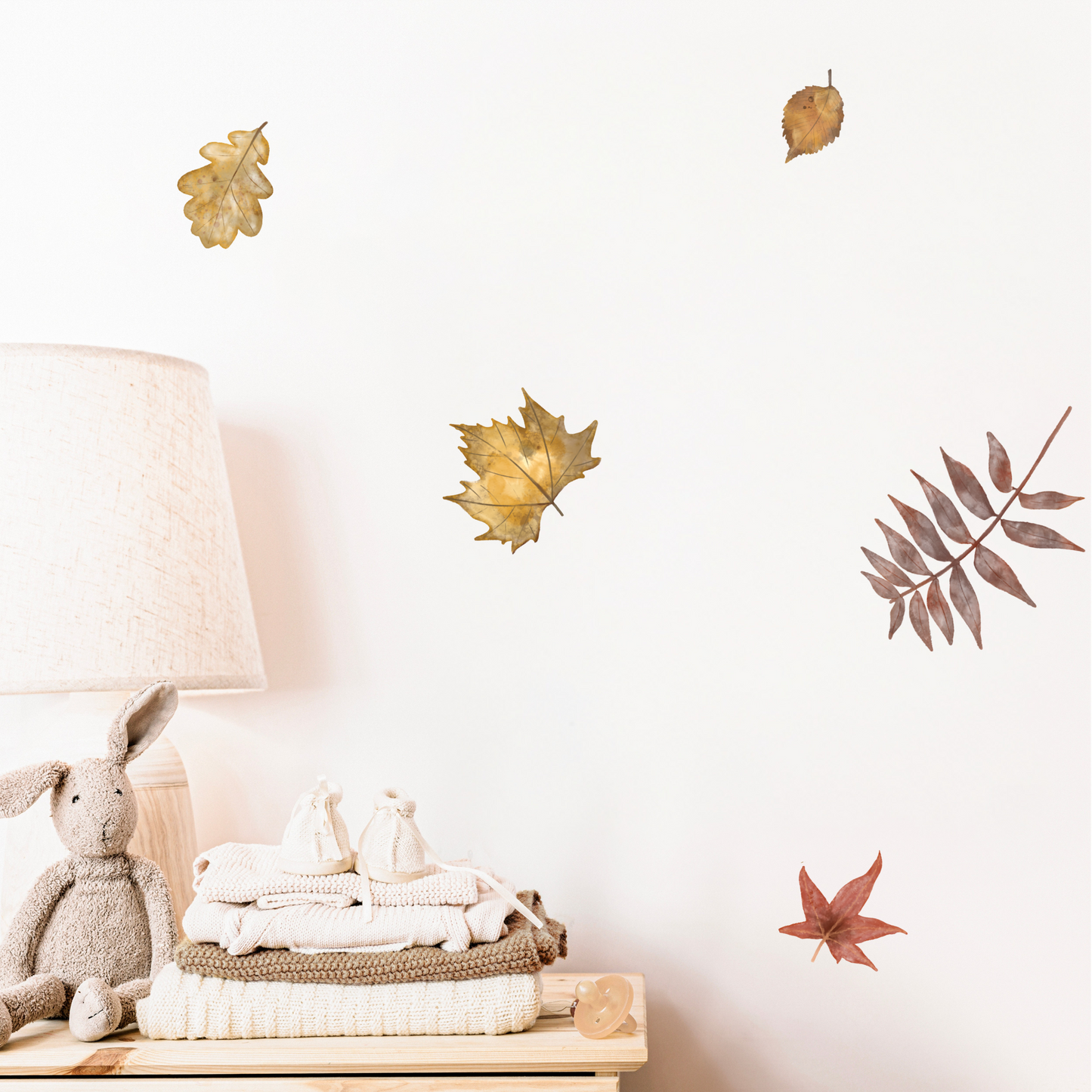 Decorative wall stickers of leaves and a lamp on a white wall. Non-toxic, eco-friendly, reusable wall stickers. Australian made.