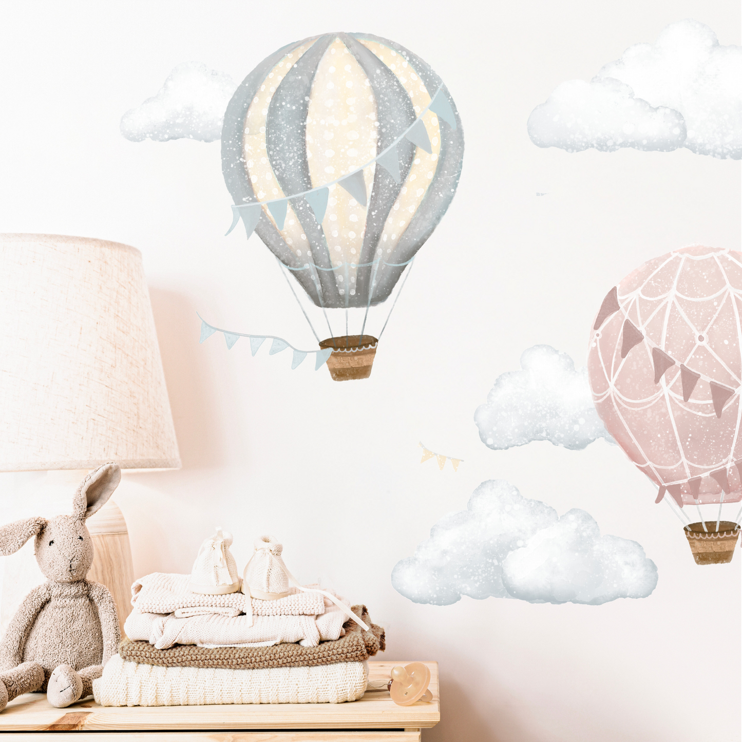 Wall decal of hot air balloons and clouds in a child's room with toys on a shelf. Non-toxic, eco-friendly, reusable wall stickers. Australian made.